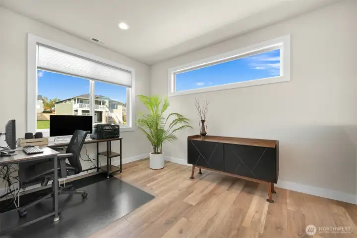 Clean and inviting second bedroom ideal for office, creative space or a welcoming guest room. With 3/4 bath conveniently located directly across the hallway.