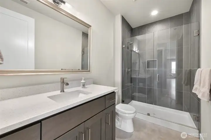 Entry 3/4 bath across from bedroom 2 as you enter the living area perfect for guests.