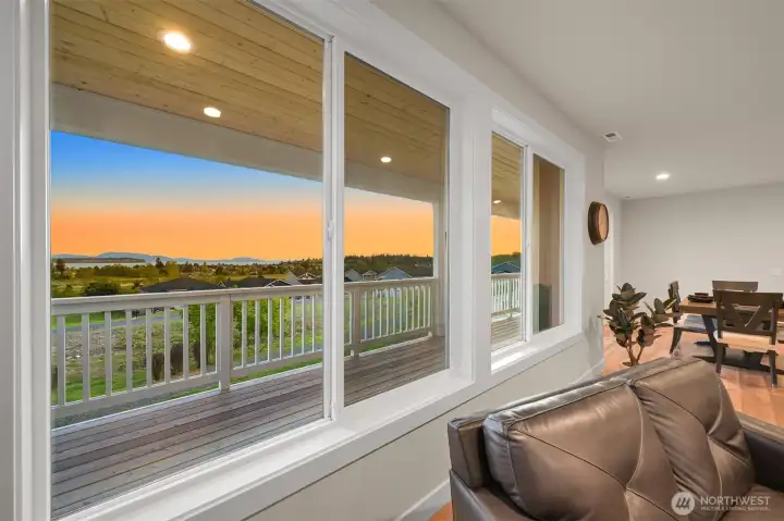 Great room deigned to capture stunning views through oversized windows.