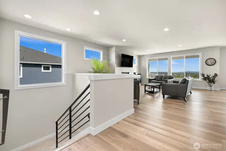 Open landing transitions seamlessly to lower lever enhancing the homes layout.