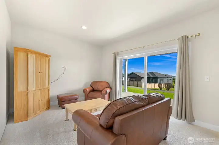 Downstairs Bonus Room with sliding glass door ground level access to backyard.