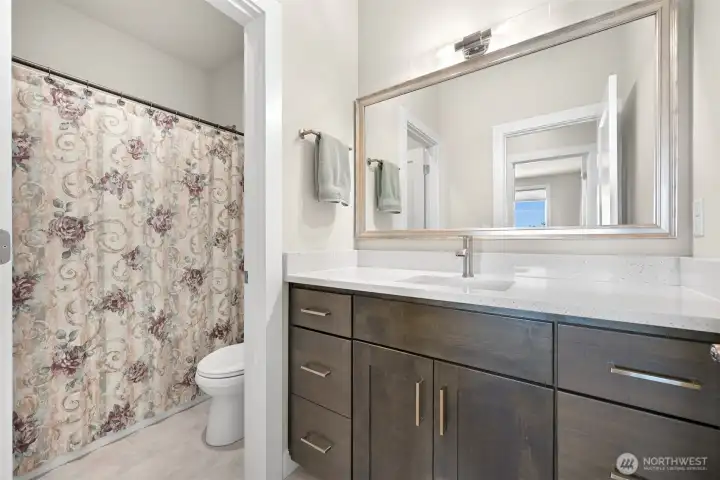 Downstairs Bathroom directly across from bedroom 3.