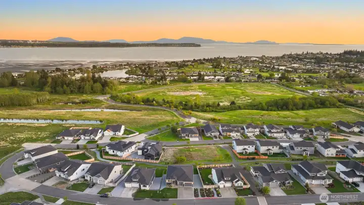 Stunning arial perspective capturing warm sunsets over the landscape & neighborhood.