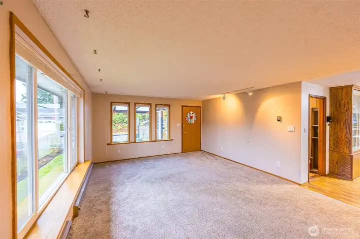Light and bright living room with new carpets.