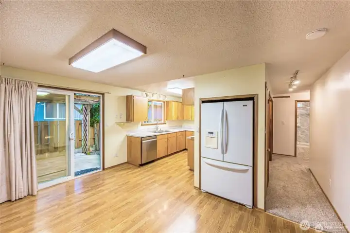 Sparkling clean and ready to move-in. View to kitchen and hallway to bedrooms.