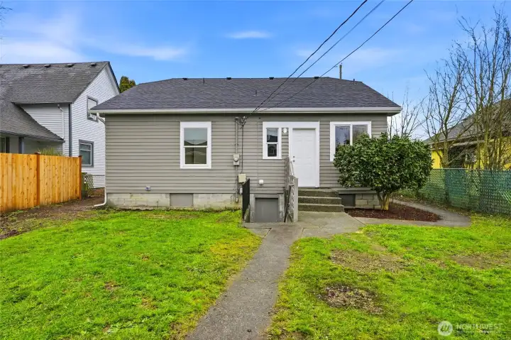 Backside of home leading into basement w/separate entrance...