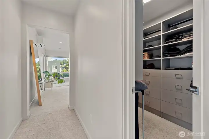 HUGE custom walk in closet with built ins.