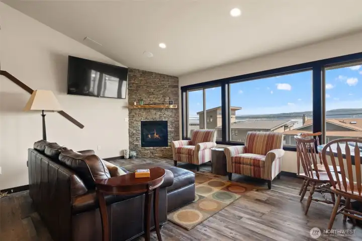 Open living room with fireplace.