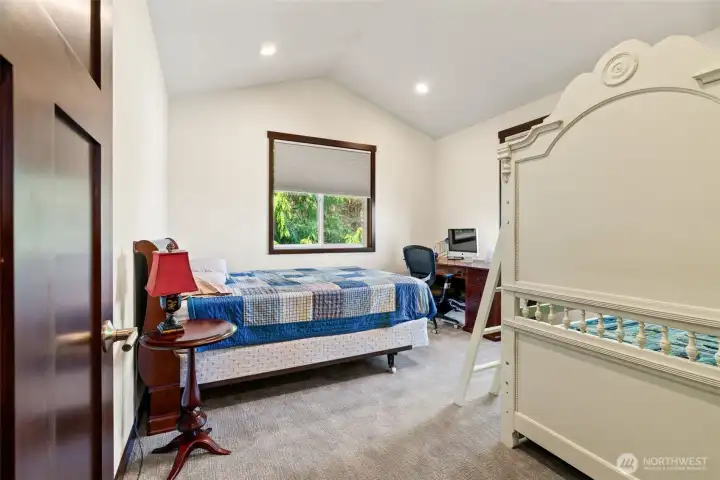 One of two upper level bedrooms.