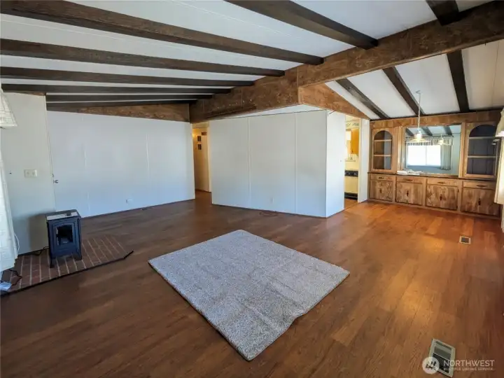 Nice size living room with vaulted ceilings and faux beams. Electric fireplace for cozy winter evenings.
