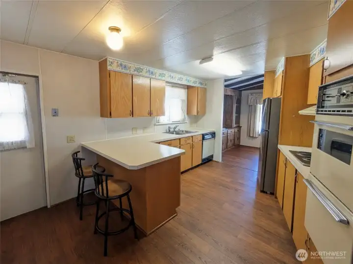 Roomy kitchen with plenty of cabinets.