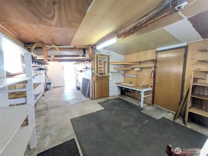 Huge workshop with plumbing and electricity. Doors leads to the backyard/patio
