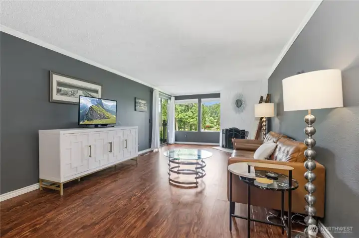 Expansive living room offers abundant space for relaxing, entertaining, or creating multiple seating arrangements.