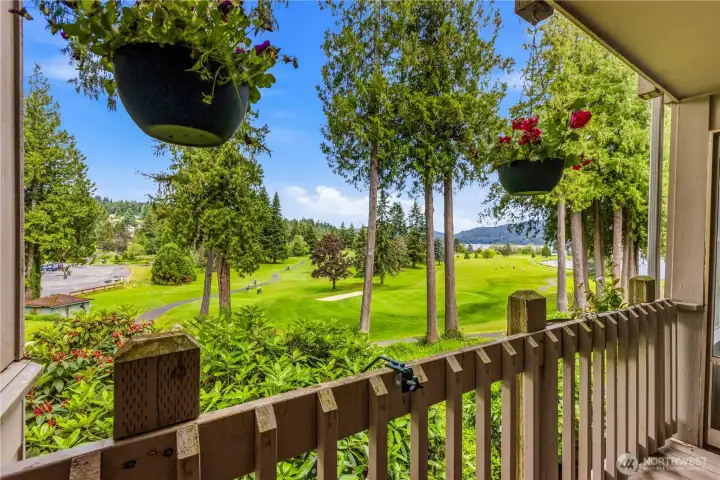 Enjoy views across the fairways from your balcony toward the lake and surrounding hillsides from this picturesque golf course setting.