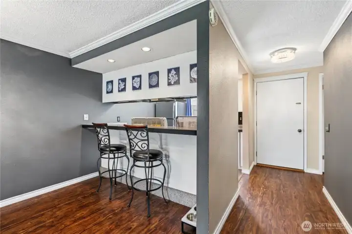 Breakfast bar provides additional seating, serving space, and casual dining options.