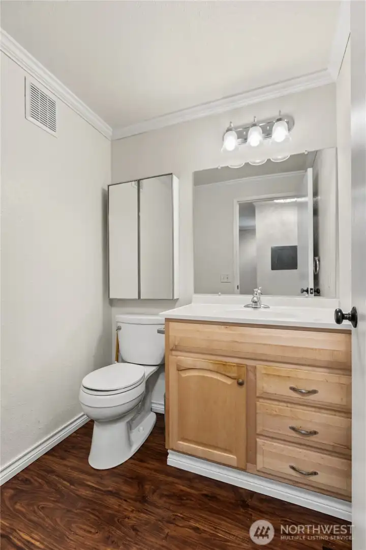 Additional bathroom provides convenience for guests and everyday living.