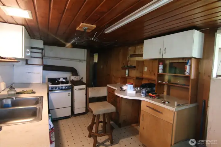Quaint kitchen with wood ceiling