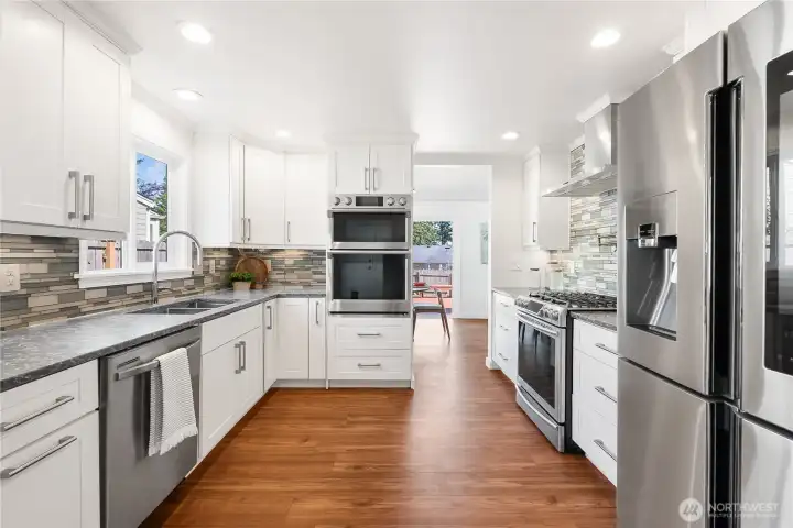 Stainless steel appliances, custom wood cabinets, double oven and a pot filler. Stainless steel appliances, custom wood cabinets, double oven and a pot filler.