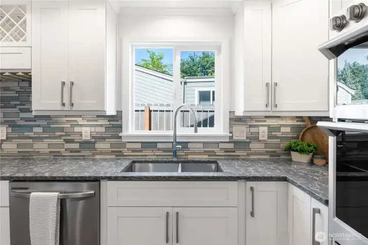 This kitchen is complete with a new dishwasher, quartz countertops throughout, and a beautiful coffee bar. This kitchen is complete with a new dishwasher, quartz countertops throughout, and a beautiful coffee bar.