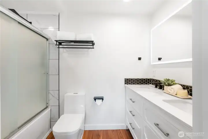 Ensuite bath complete with double vanity, heated mirror, tiled shower, and bluetooth speakers. Ensuite bath complete with double vanity, heated mirror, tiled shower, and bluetooth speakers.