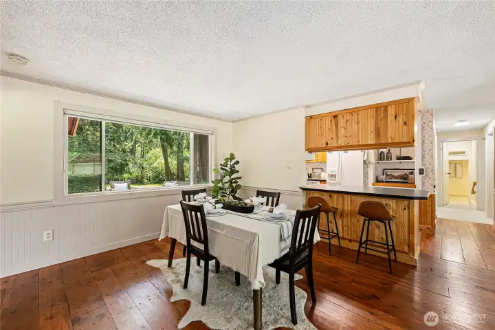Flows into the dining area connecting to an additional gathering room