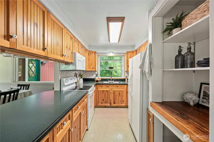 Large window over the kitchen sink, storage is abundant