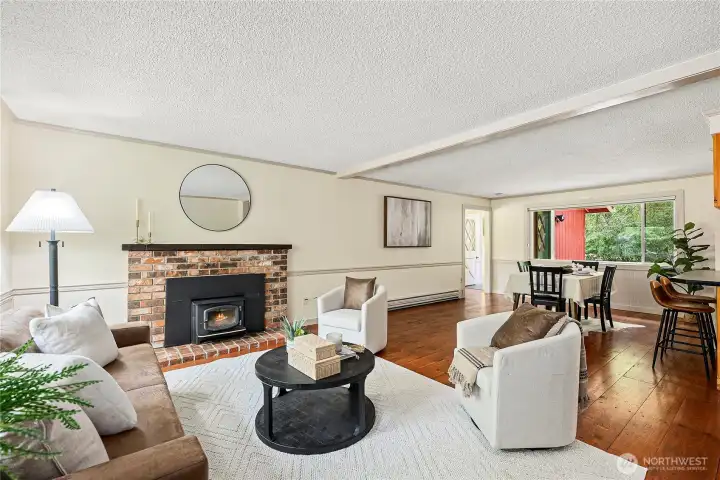 2nd gathering room perfectly cozied by a wood fireplace