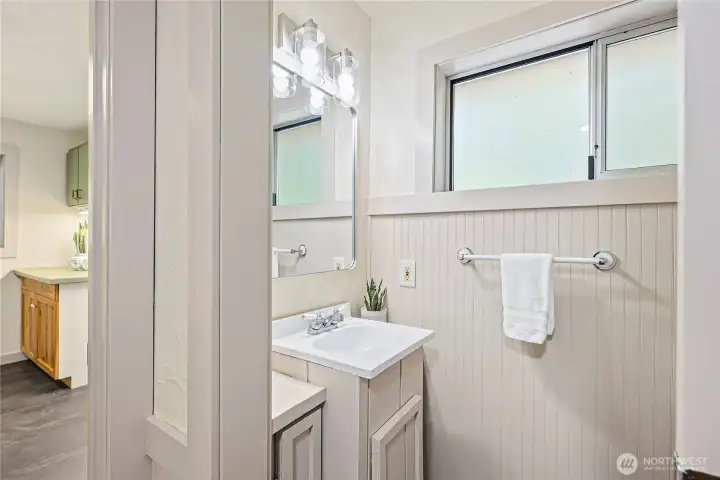 Half bath just off the mud room, easily accessible from the back door the leads to the deck