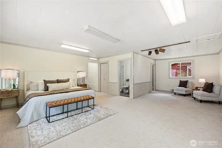 Primary bedroom is so huge! Large windows, on-suite bathroom, walk-in closet