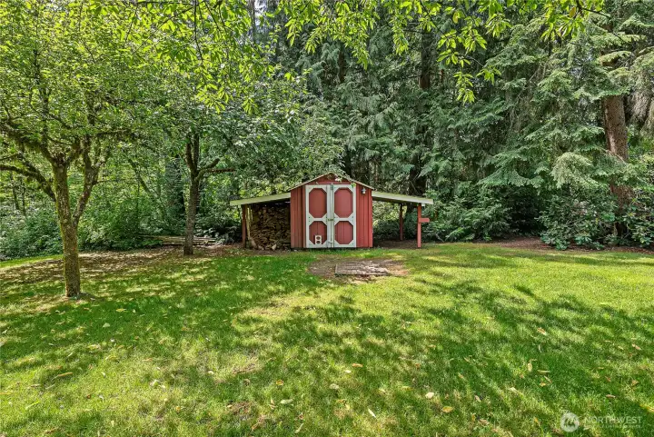 A great garden shed with more firewood storage
