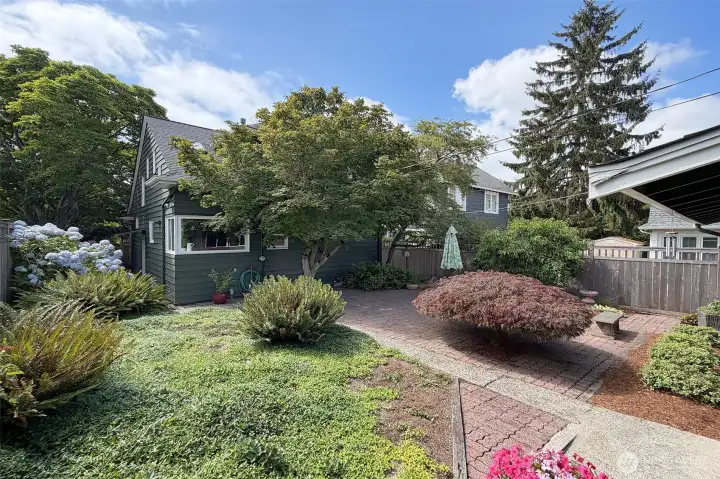Large and lovely low maintenance fully fenced yard with great size patio for entertaining.