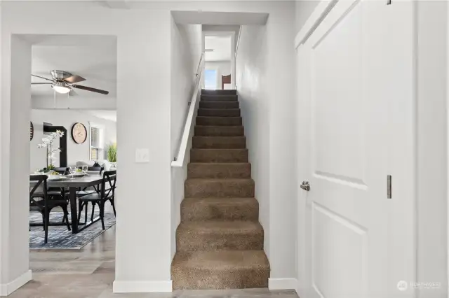 Stairs lead to primary bedroom + 2 other large bedrooms.