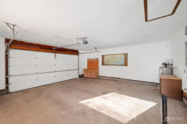 Garage offers soaking tub, newer hot water tank & furnace & there is also a heat pump.