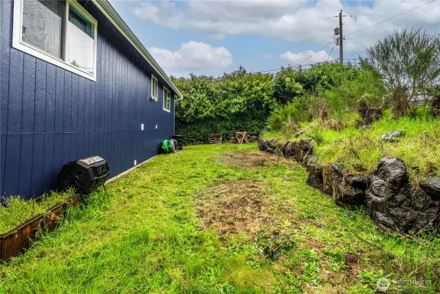 Backyard includes fire pit and