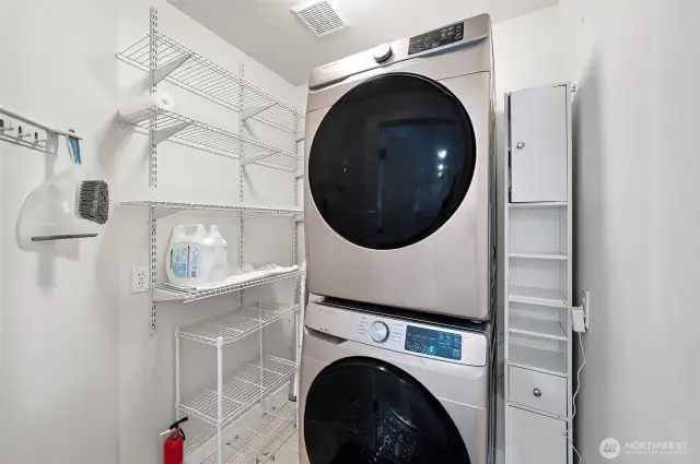Downstairs walk in pantry and stackable newer washer and dryer