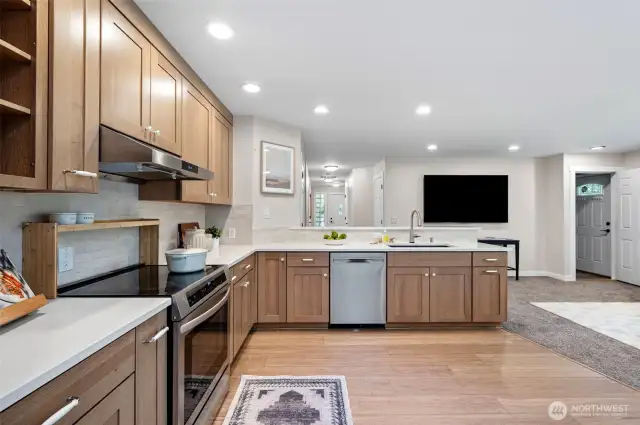 Gorgeous and modern 2024 kitchen remodel.  Bamboo floors.  Custom cabinets.  And an eat-in kitchen with room for a table and chairs