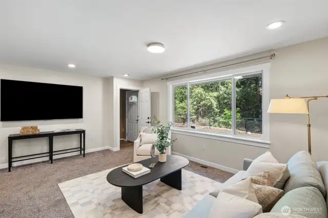 Living room with peek at separate entrance to upstairs