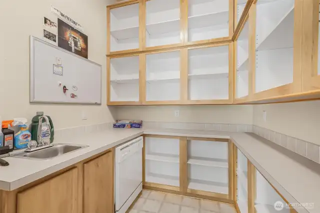 Butler’s Pantry of your dreams!  Complete with a shelving, sink a second dishwasher and second fridge.