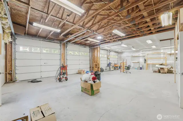 The Shop/Garage dreams are made of! 38x71 (2,698sqft) 4-Bay detached garage/shop with full 10x25 insulated storage room and a 38X25 finished and insulated hobby room with sliding glass doors to its own patio.  220 outlets, air compressor and a 440 outlet in the garage. Pellet stove is installed in the insulated hobby room and the room is plumbed for a potential bathroom.