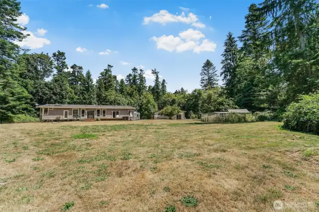 Spacious grounds with a chicken coop and 12.88 acres to play!