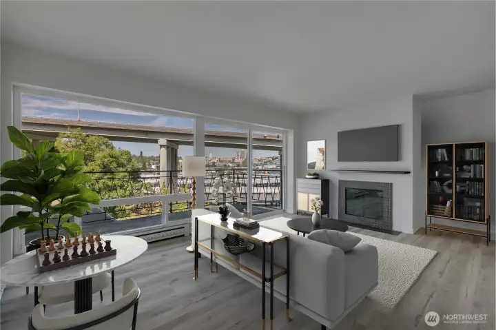 The living room showcases expansive, oversized windows that fill the space with natural light. New flooring adds a fresh, modern touch while still preserving the home’s original charm.