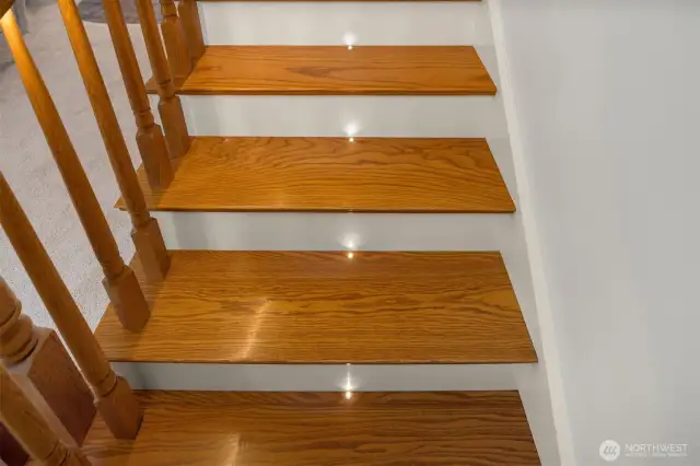 Staircase features custom built-in lights that change colors.