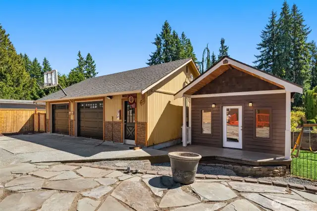 Newly updated studio-like outbuilding next to detached garage.