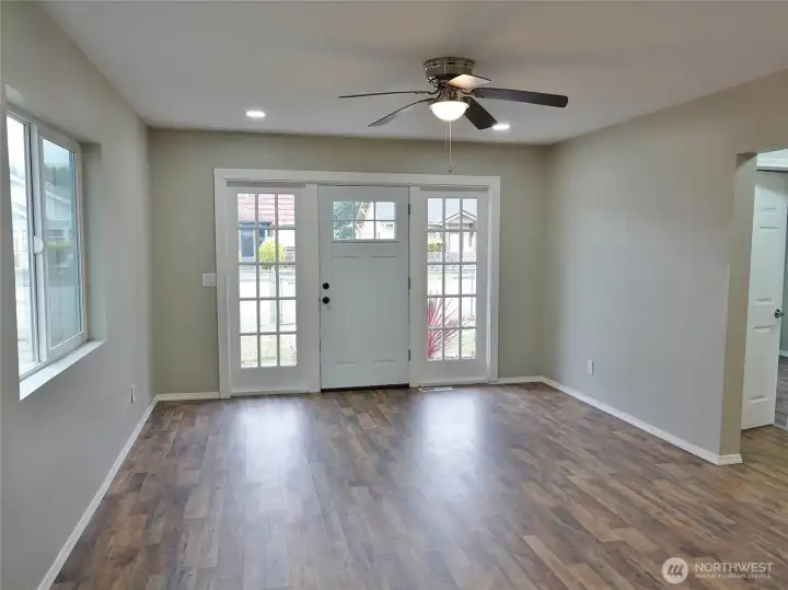 Light and Bright Entry and Living Room w/ LVP flooring.