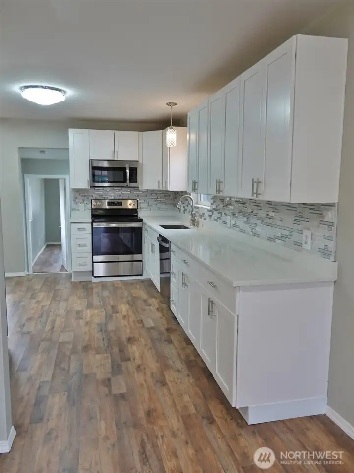 The Living Room leads into the Kitchen.