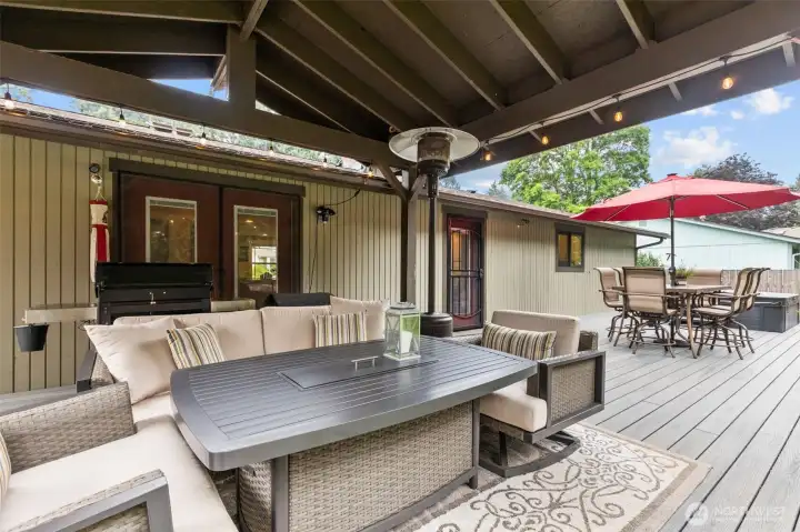 Backyard Retreat – Trex deck with well-maintained hot tub, and covered cabana seating.