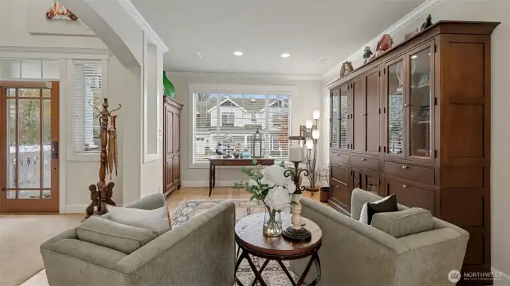 Beautifully updated solid front entry door and hardware.  Entry vetibule is a perfect place to read a book and relax on a Saturday morning.