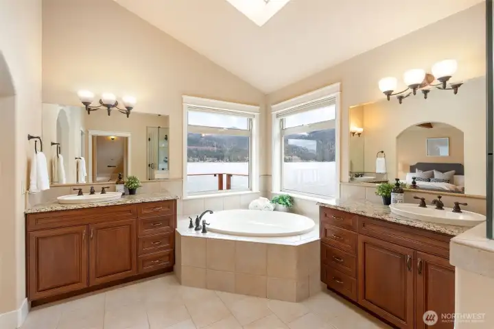 The primary bath is a master class in luxury living.