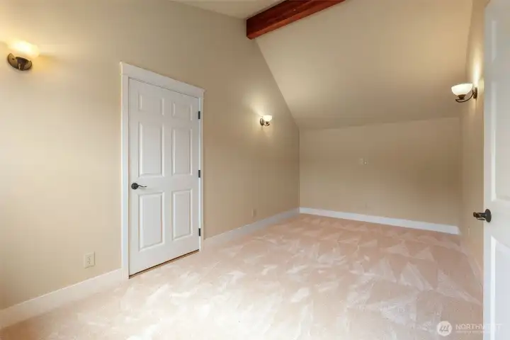 Through the primary closet is a secluded bonus room for your home office or peaceful reading nook.