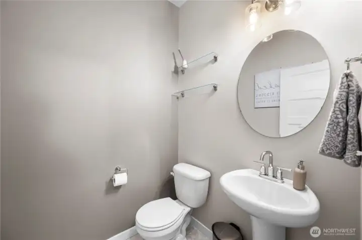 Main floor powder room thoughtfully placed for everyday convenience.